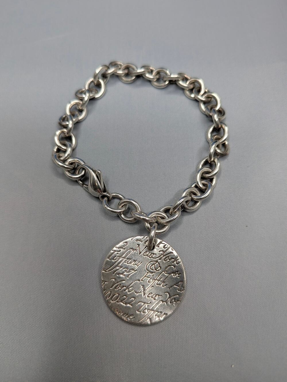 TIFFANY & Co. Sterling Silver Notes Round Script Charm Bracelet 7"